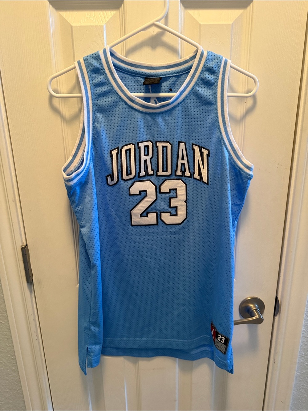 Jordan baby blue authentic jersey. Boys XL